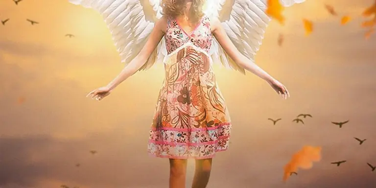 A woman with large white wings standing in a floral sundress within a warm sunset, birds flying in the distance.