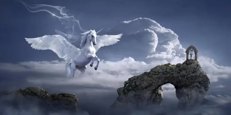 White winged horse (Pegasus) flying above misty clouds near a rocky stone arch.