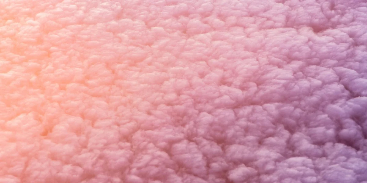 Soft pink and peach clouds with a gentle gradient, suggesting transition and surrender