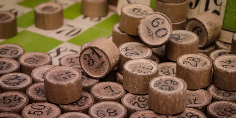 Close-up of wooden lottery balls with numbers