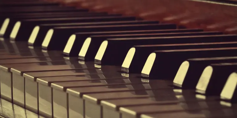 Close-up of piano keys with soft lighting, evoking a dreamlike atmosphere.