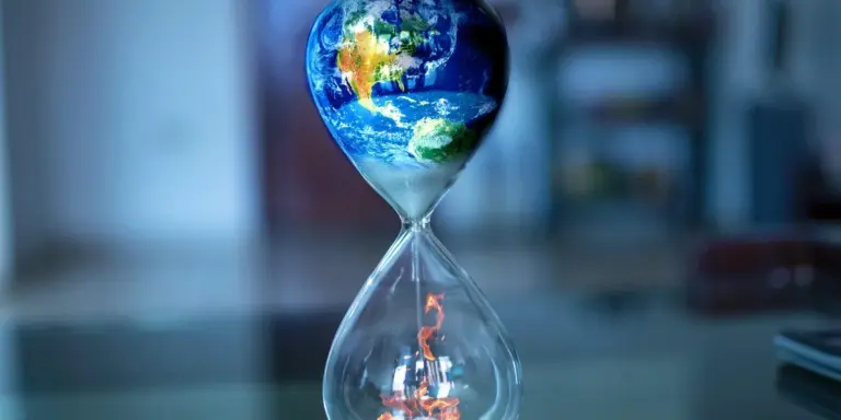 Hourglass with a globe of the Earth in the top bulb, symbolizing warped time perception in dreams